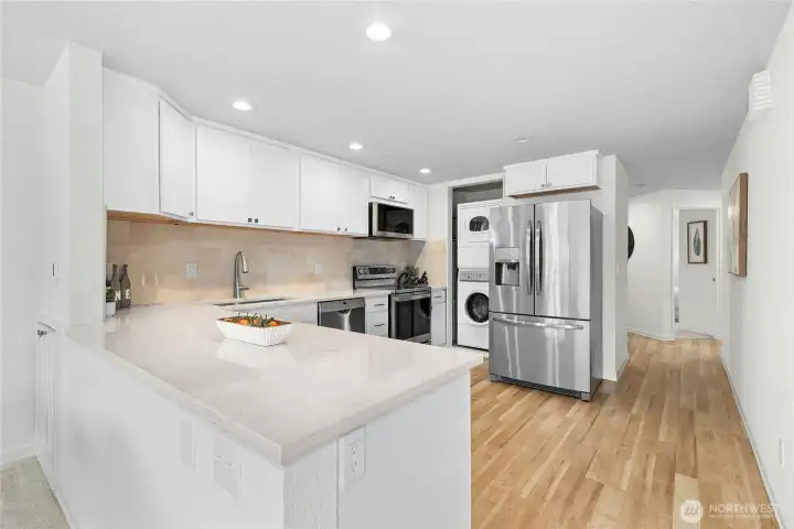 including a commercial washer and dryer on slides for easy access