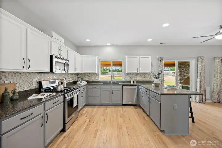 Updated Kitchen w/ Stainless Appliances Including Gas Range, Slab Granite, Breakfast Bar!