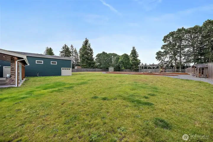 Fenced, Level, 1 Acre Parcel w/ No Direct Neighbors Behind! Sprinkler System, Play Structure, Fire Pit Area, & Garden Shed!