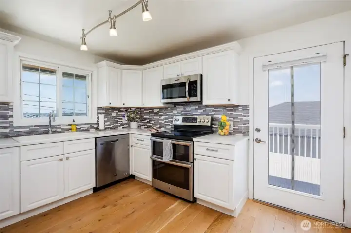 The kitchen also has a door that leads to an East facing deck