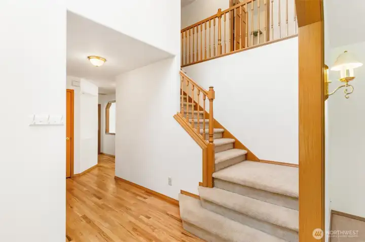 Grand entryway with a sweeping staircase and clear sightlines into the heart of the home. Grand entryway with a sweeping staircase and clear sightlines into the heart of the home.