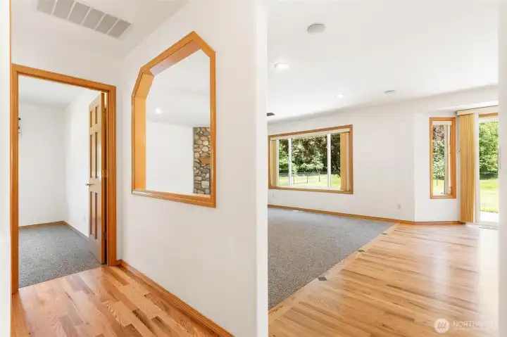 Beautifully refinished hardwood floors (2026) shine throughout the main level, adding a touch of elegance to every step. Beautifully refinished hardwood floors (2026) shine throughout the main level, adding a touch of elegance to every step.