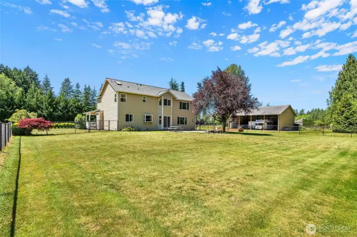 Massive, level backyard—plenty of room for play, gardening, summer BBQs and MORE! Massive, level backyard—plenty of room for play, gardening, summer BBQs and MORE!