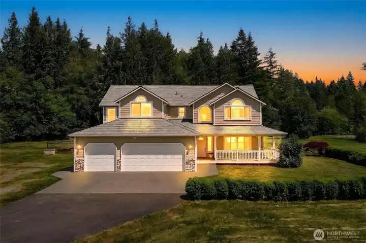 Beautiful evening view of the home, showcasing the privacy and security of this gated enclave. Beautiful evening view of the home, showcasing the privacy and security of this gated enclave.