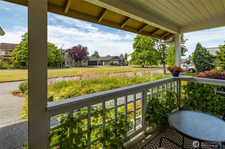 Covered front porch with room for table and chairs and plants