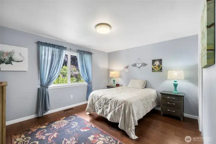 Primary bedroom that looks out to the backyard