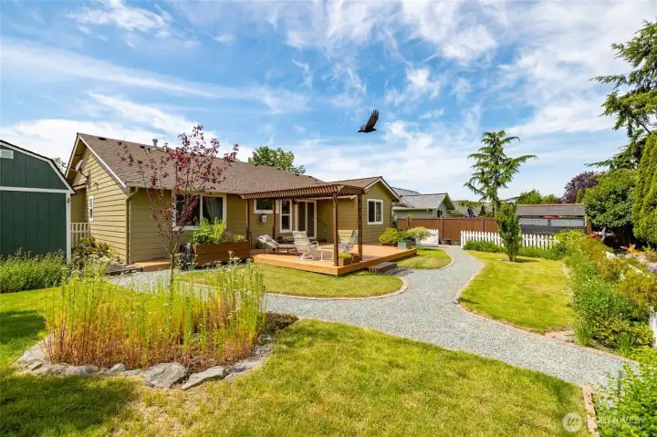 Backyard with plenty of room for your garden, kiddos or critters. New expanded deck back here too.