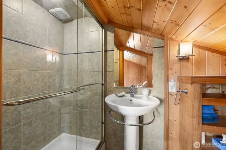 Shower is fully tiled.