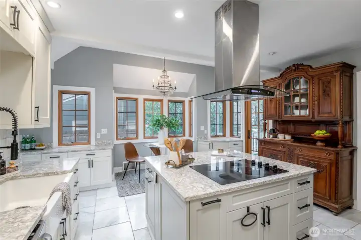 This update kitchen has a luxurious feel with a double oven and a brand new fridge. This gorgeous hutch conveys with the home.