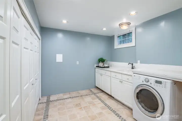This large laundry has plenty of storage space.