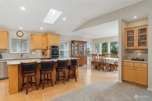 Eat-in kitchen with recessed lighting and a skylight.