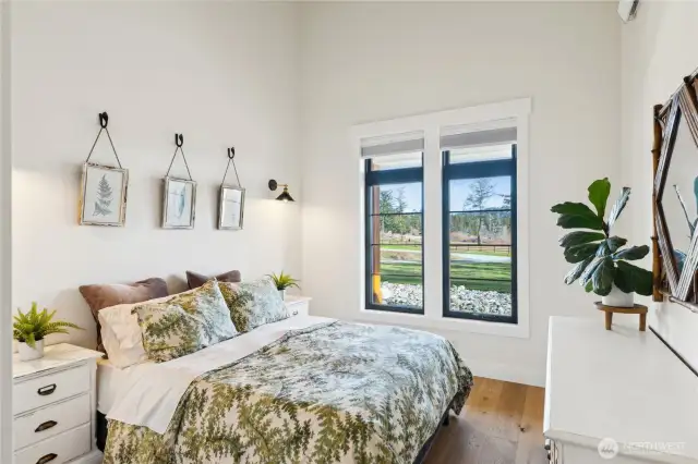 Guest room #3 with soaring ceilings, Cove radiant wall heating for consistent, zonal heat. wood flooring and light, bright windows!!