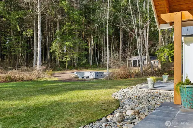 Lush, green grassy lawn is perfect for yard games, somersaults, running free and enjoying the outdoors. Hot tub area to enjoy quiet conversation and starry nights.