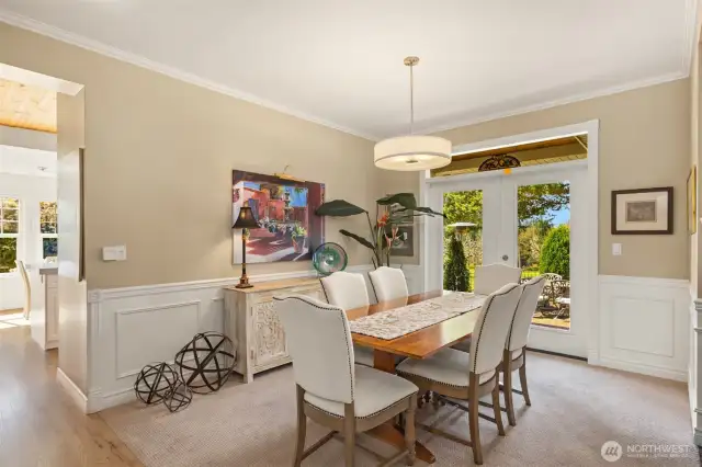 Back inside, the home flows seamlessly into the kitchen, laundry room, walk-in pantry, and a full main floor guest bath.