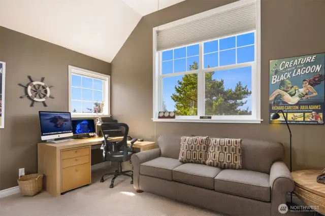 Upstairs, you'll find three additional bedrooms complementing the main floor primary suite and den/office. One of these bedrooms—complete with a closet (not pictured)—has been utilized as an office and offers one of the home's most stunning views of the golf course.