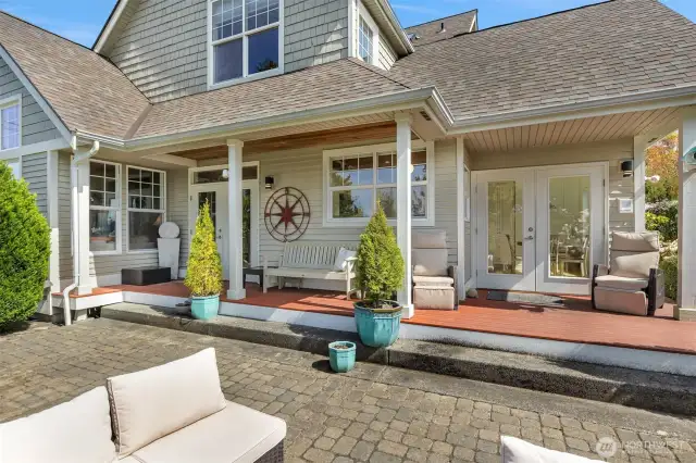 Back outside, the inviting deck transitions seamlessly into the spacious back patio, creating a welcoming setting for outdoor relaxation and entertaining.