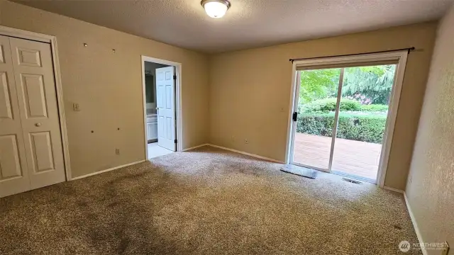 Primary bedroom with convenient slider door to the deck