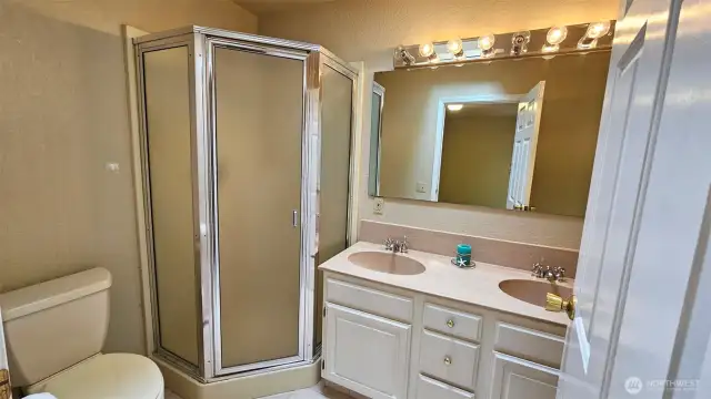 Primary bathroom, 5-piece bath. Dual sinks, jetted tub, toilet, shower stall