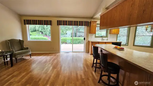 Hardwood floors in the kitchen and flex space areas. Slider leads to the large, refurbished deck.