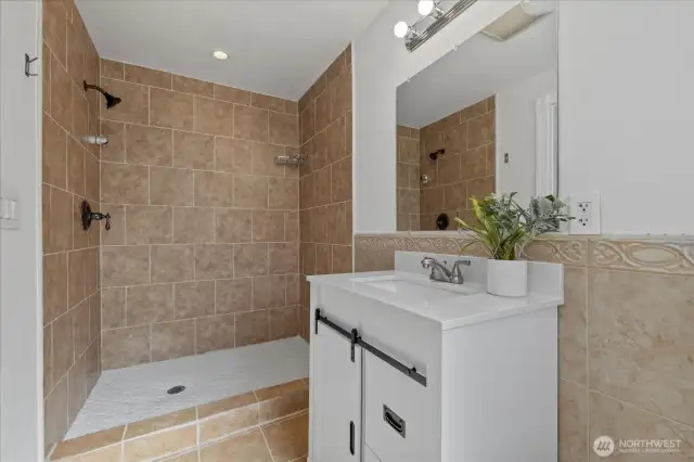 3/4 bath off primary bedroom with new cabinets