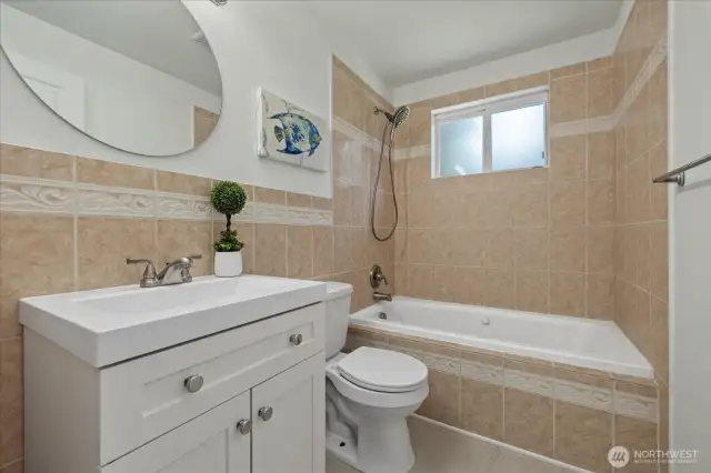 Full bath for guests, new cabinets.