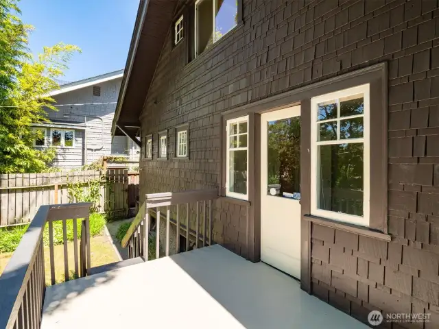 Door from back room on the main level goes to a deck. Under the deck is a door to the lower level.