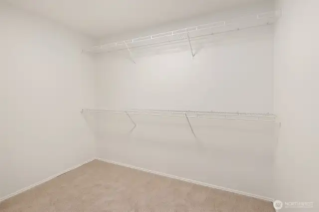 Spacious primary closet.