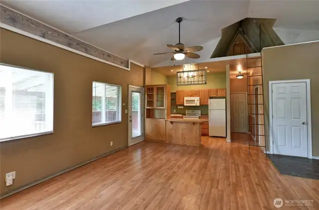 Looking in to kitchen from living room. Storage up in loft.