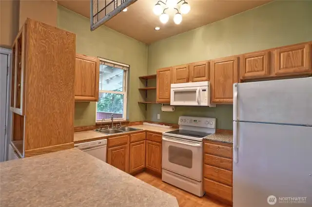 Another look at kitchen with eating bar.