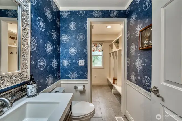 Main floor half bath/laundry - separated by a pocket door.