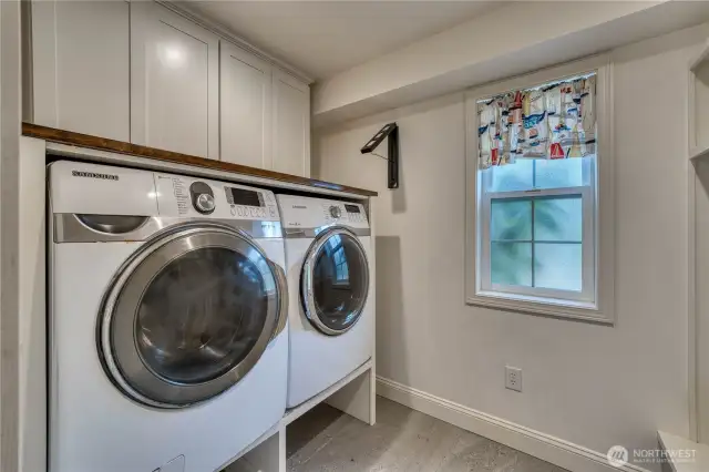 Main floor half bath/laundry - separated by a pocket door.