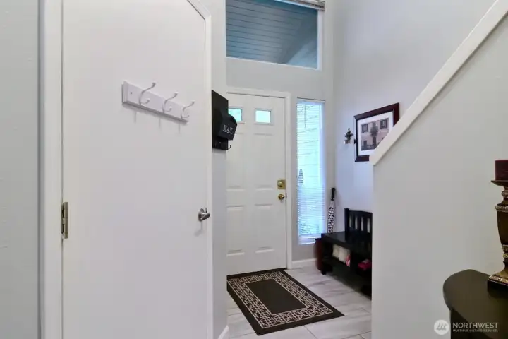 Entryway with door to the garage and the staircase