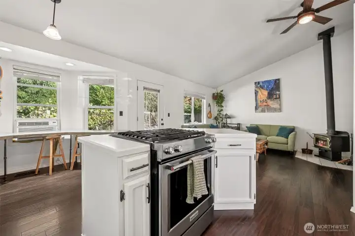 The kitchen has eating space and flows into the family room
