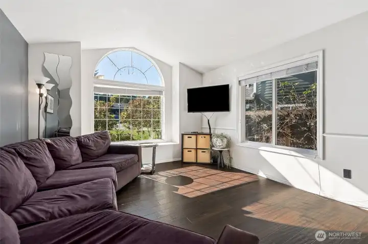 The living room is just to the left of the front door