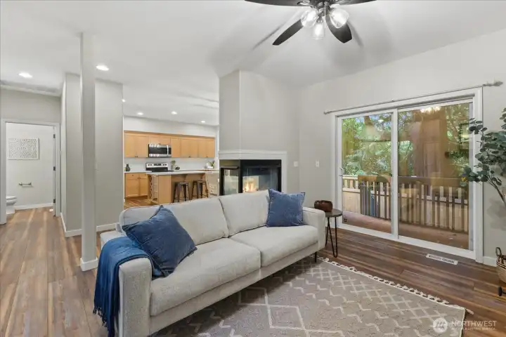 Living room looking into kitchen and hallway to 1/2 bath