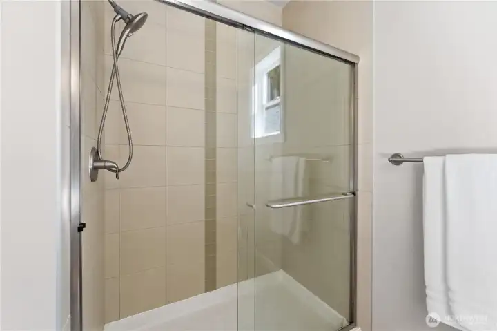 Downstairs 3/4 bathroom located on the main floor, highlighted by a walk-in shower and a very clean, well-kept space