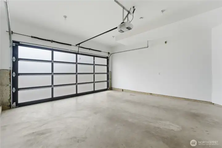 An oversized two-car garage that’s impressively clean and versatile for parking, storage, or hobbies