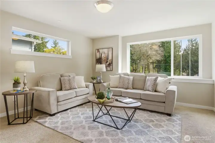 Heading upstairs, you arrive at a bright and spacious bonus room filled with natural light.  TV room, playroom or ?