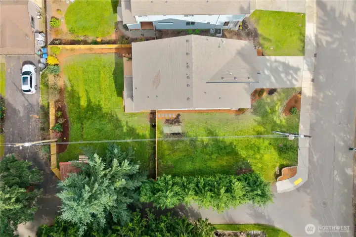Overhead view of the property’s large corner lot, clearly showing its size, shape, and spacious outdoor potential