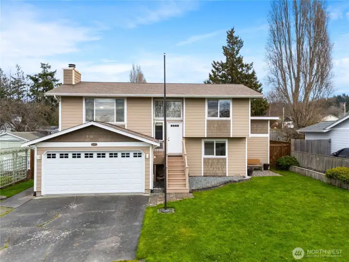 This well-maintained split-level home offers classic curb appeal, a spacious driveway, and a tidy yard in a friendly, established neighborhood.