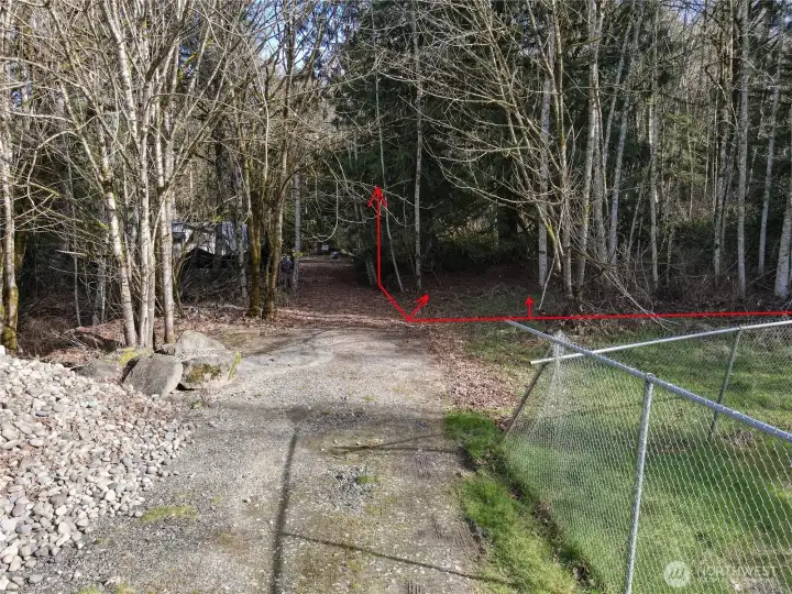 Paved street ends then gravel road into the acreage. Gravel road divides the two 7.5 ac lots. Only acreage on the right is for sale.