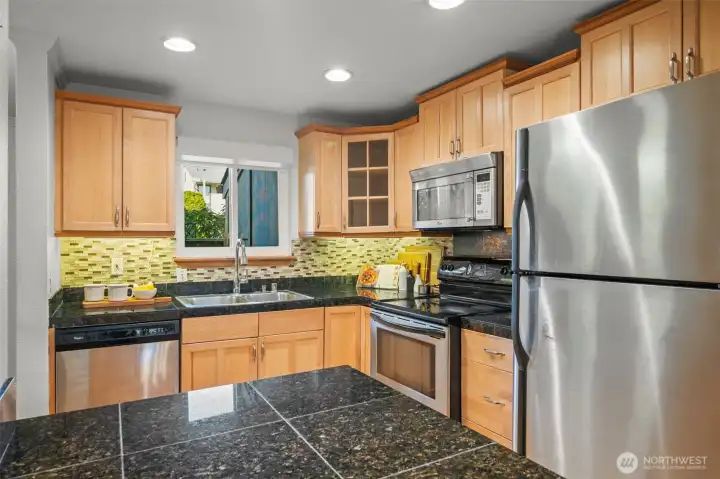 Granite island and bright designer backsplash!