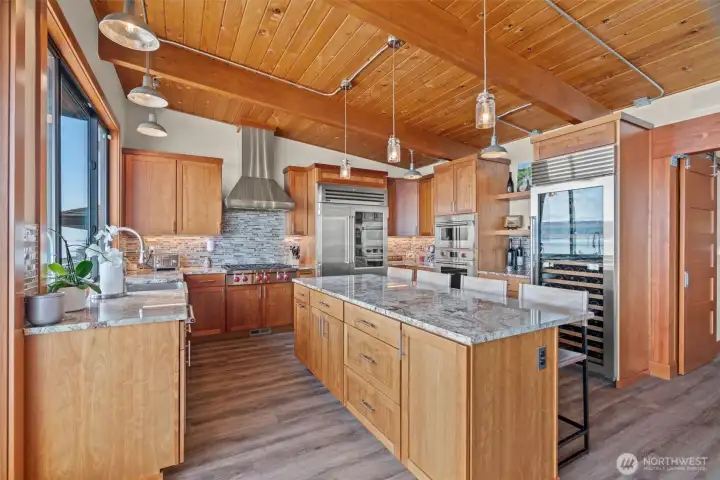 Kitchen with center island and Wolf/Sub Zero  appliances including wine refer.