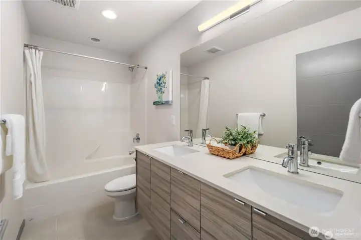 Main hall bath on the second floor with bathtub and double vanity!