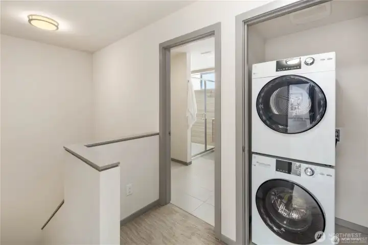 Washer dryer conveniently located in upstairs primary suite