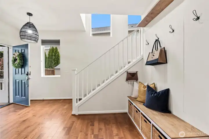Enjoy the thoughtfully designed drop zone featuring built-in seating, storage baskets and hooks to keep everyday essentials beautifully organized.