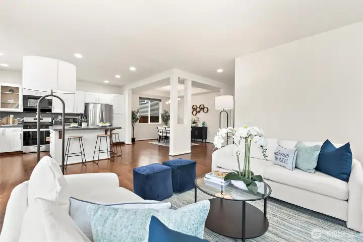 light filled living room, kitchen and dining space is seamlessly connected for entertaining.