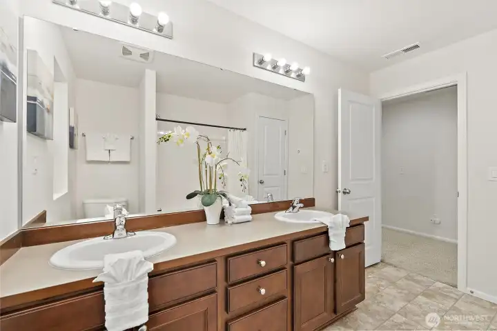 Large upstairs main bath with double sinks.