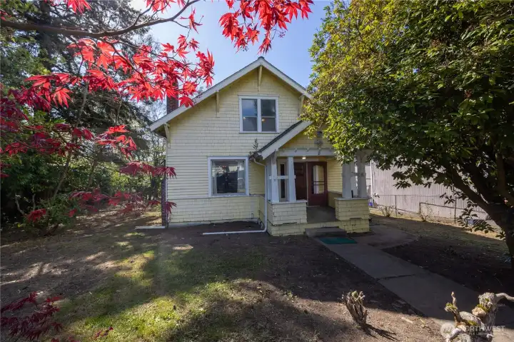 Sweet home, with covered front porch, sits on over a quarter acre.