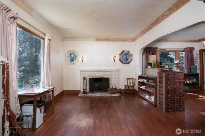 The living room and dining room are grand in size and waiting to be spiffed up and made beautiful again.